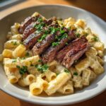 cheesy garlic butter steak with rigatoni in four cheese sauce