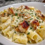 cheesy garlic butter chicken rigatoni in creamy alfredo sauce