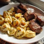 garlic butter steak bites with creamy parmesan tortellini and garlic sauce
